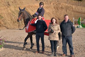 Liam O Meara (Curraghgraigue Jack Takes Flight) - league winner of the Connollys RED MILLS Spring Tour - pictured with John Geraty (Red Mills), Jennifer Molan (Maryville) and Ronan Corrigan (Chairman, The Showjumpers Club)